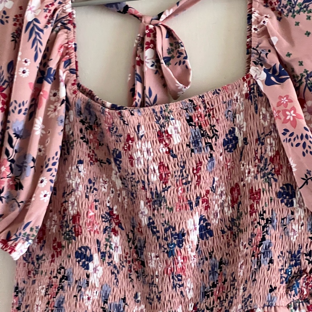 Found on Amazon jumpsuit with pink background and floral design, square neckline